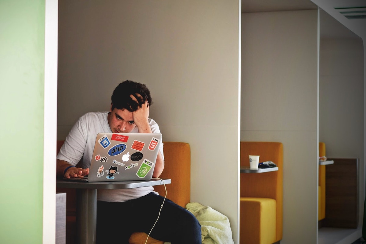 People working with computers and paper to process survey results